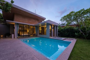 Modern house with a swimming pool, modern pool villa at the beach